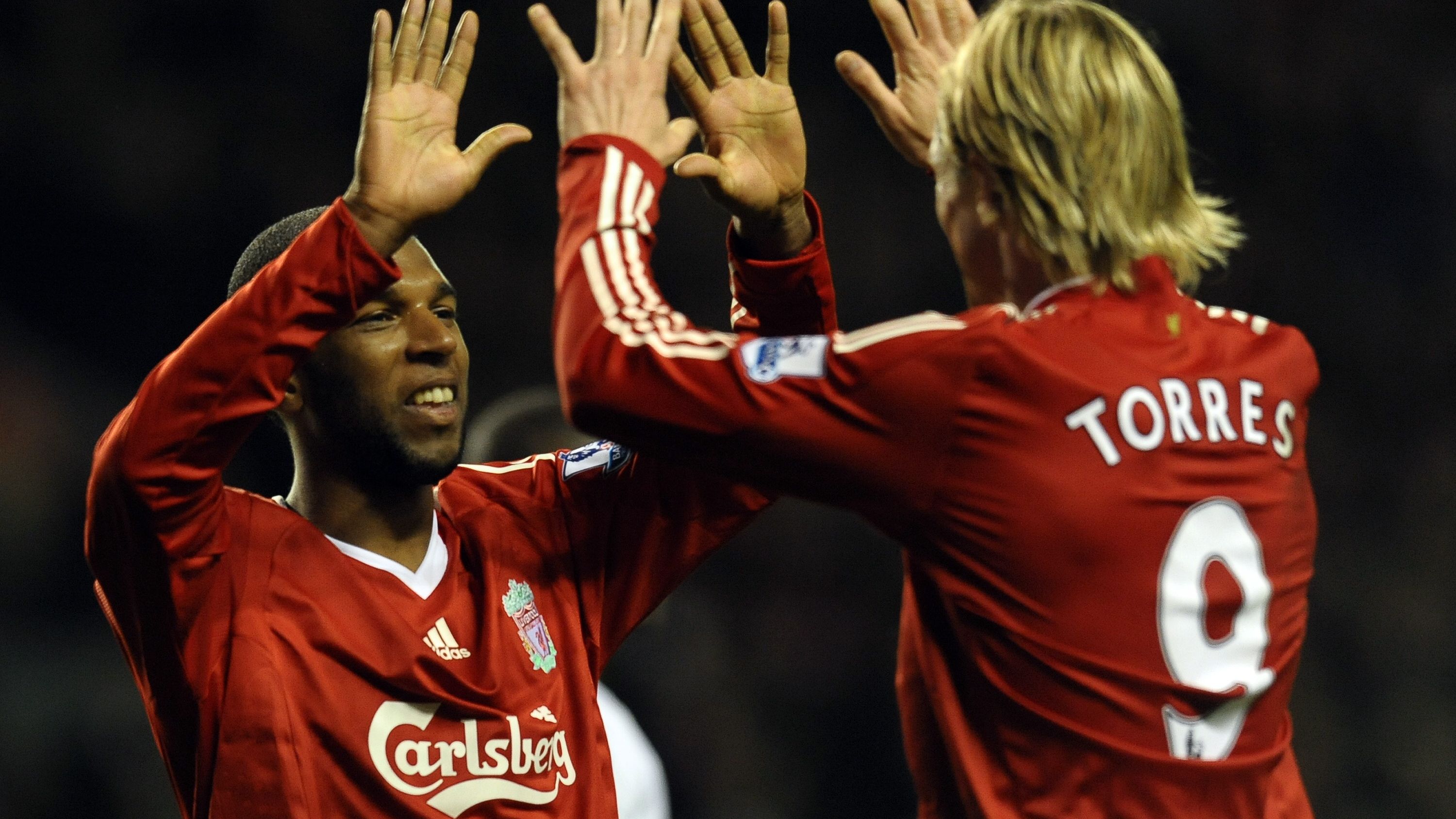 Liverpool's Dutch forward Ryan Babel (L)