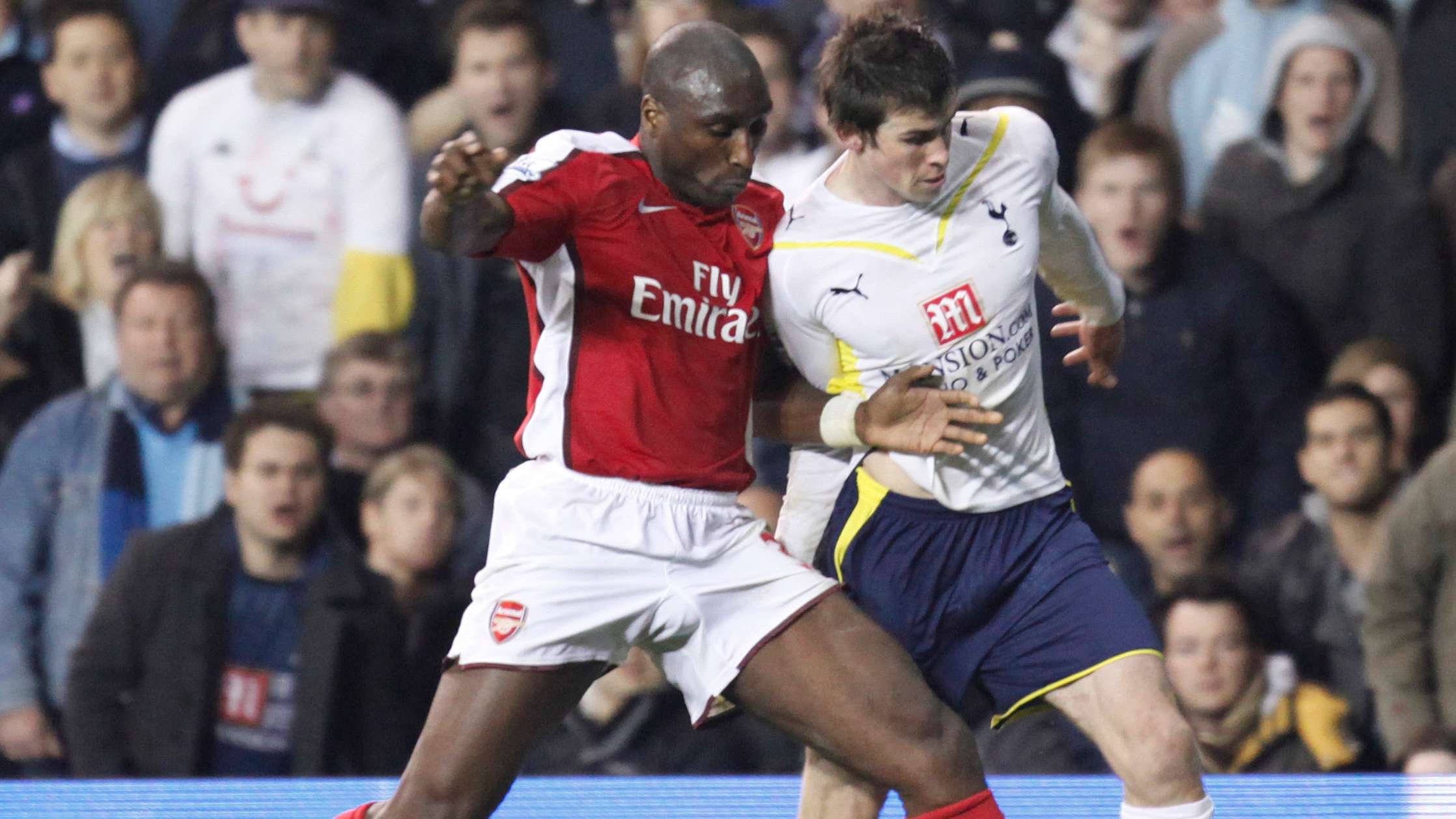 Arsenal's Sol Campbell (L) challenges To