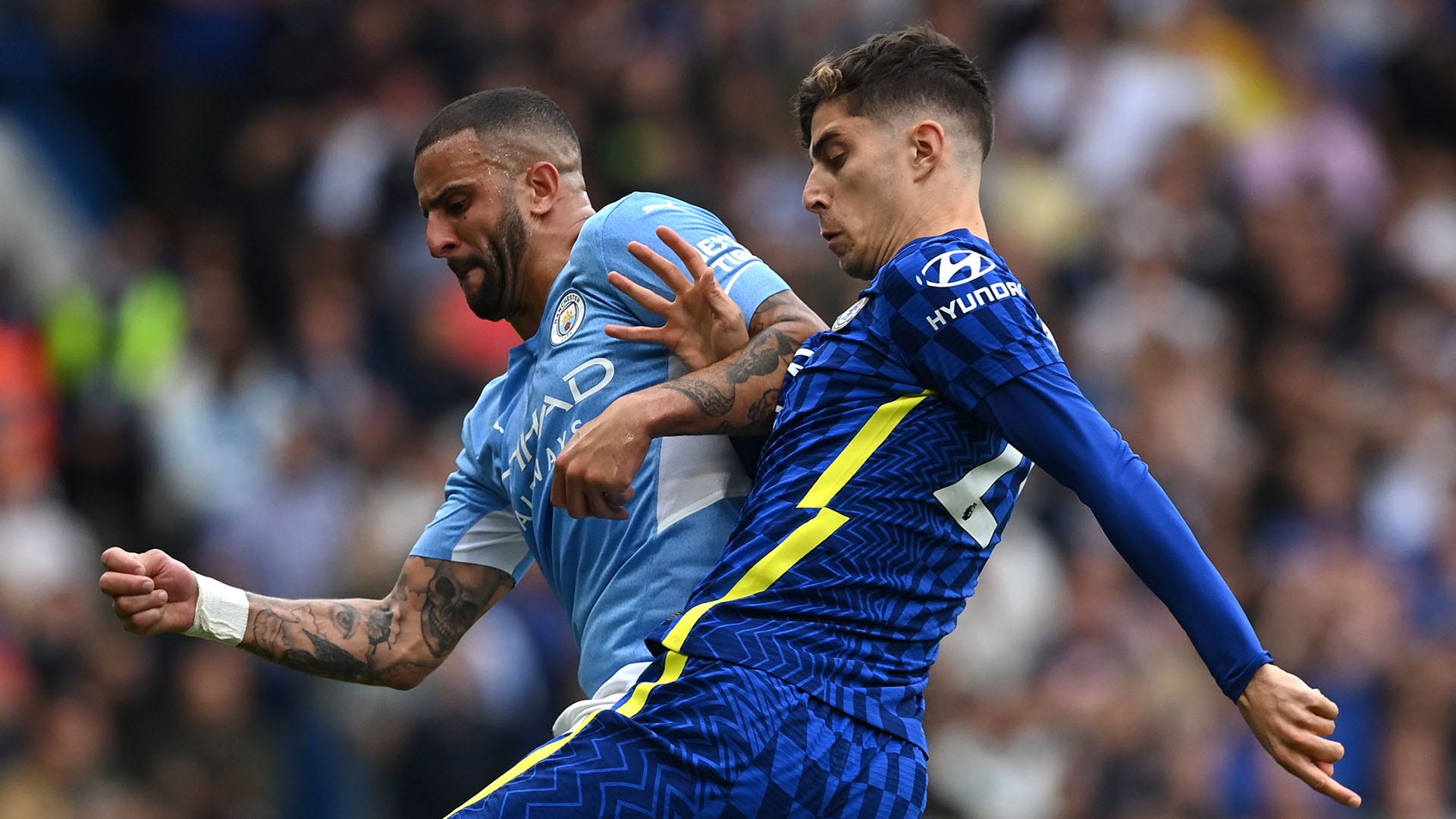 Kyle Walker of Manchester City is tackled by Kai Havertz of Chelsea