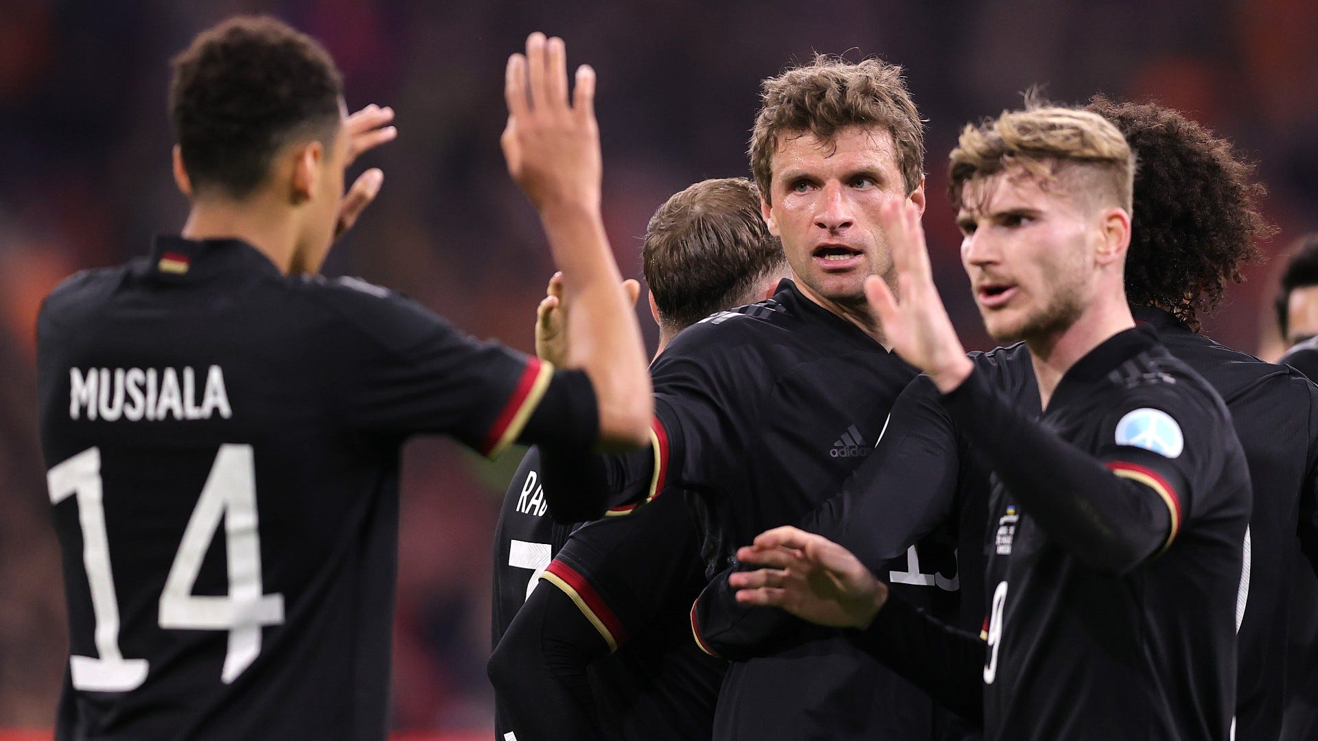 Thomas Mueller of Germany celebrates after scoring their side's first goal with Timo Werner and Jamal Musiala 