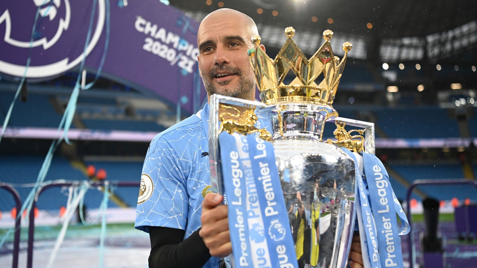 Pep Guardiola Manchester City Premier League trophy 2020-21