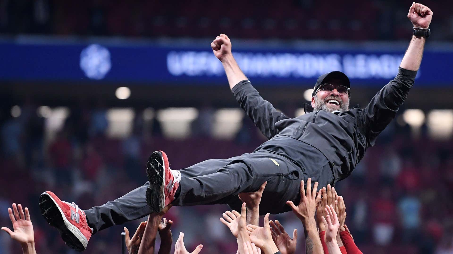 Jurgen Klopp, Manager of Liverpool is thrown in the air as he celebrates with his players and staff after winningduring the UEFA Champions League Final 