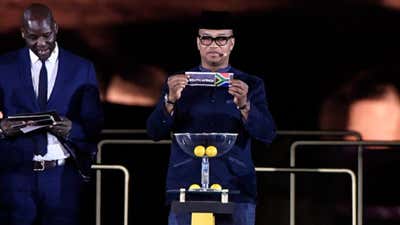 Former Senegalese striker El Hadji Diouf shows South Africa's ballot during the 2019 CAF African Cup of Nations (CAN) draw ceremony