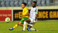  Ethan Brooks of South Africa is tackled by Mubarak Wakaso of Ghana.