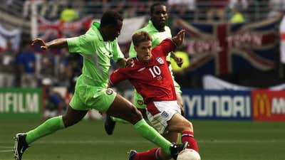 Isaac Okoronkwo of Nigeria, England's Michael Owen, 2002