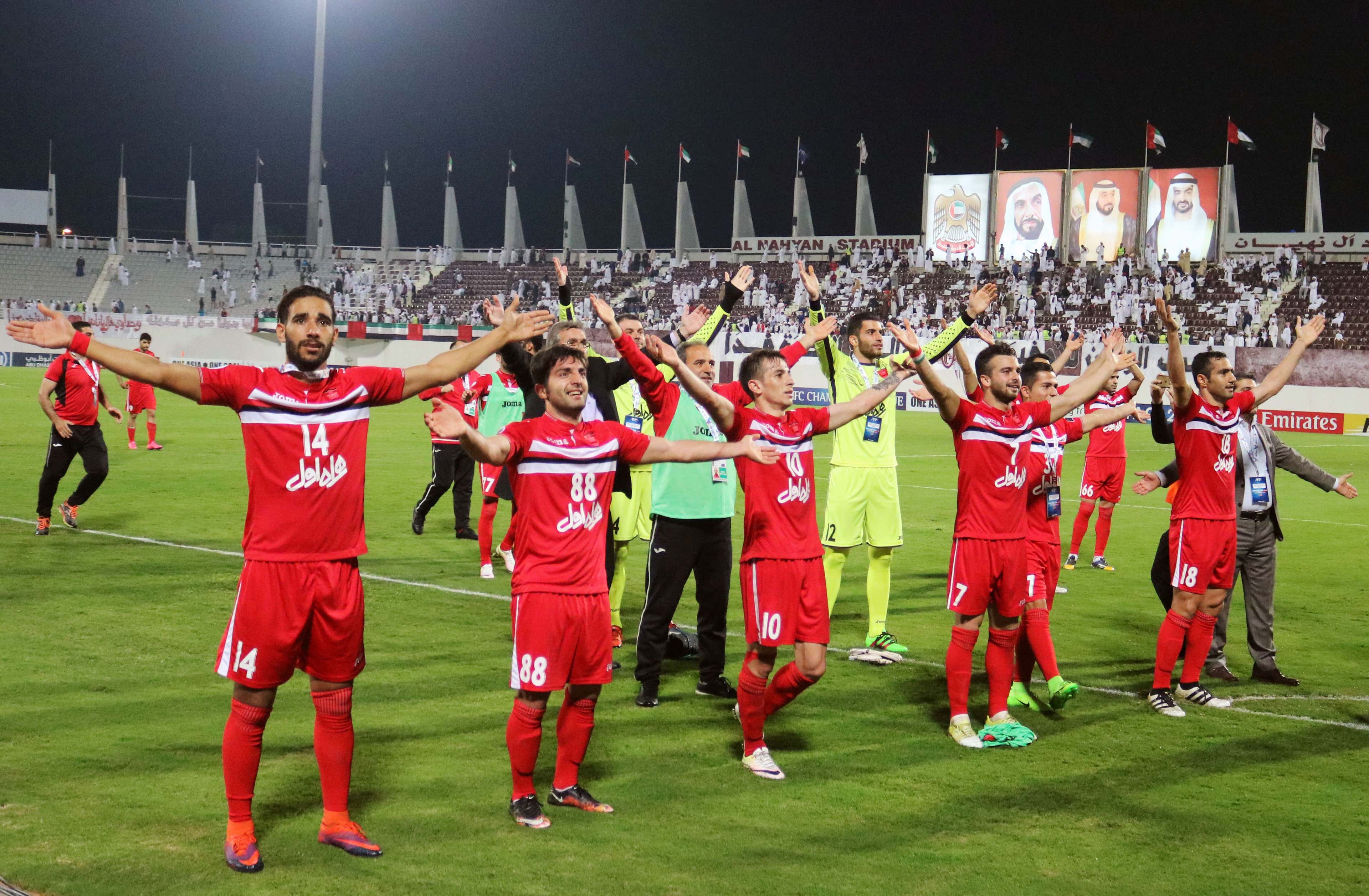 Persepolis's players celebrate after winning the AFC Champions League qualifying football match between UAE's Al-Wahda and Iran's Persepolis on February 28, 2017
