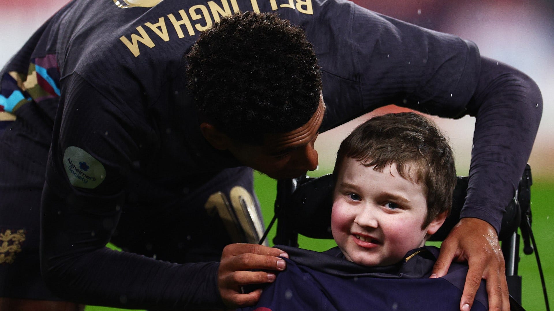 VIDEO: Jude Bellingham goes viral for heart-warming gesture as England star gives disabled mascot his tracksuit in pouring rain at Wembley