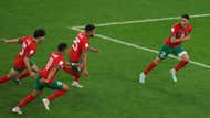 Morocco players celebrate Achraf Hakimi's winning penalty.