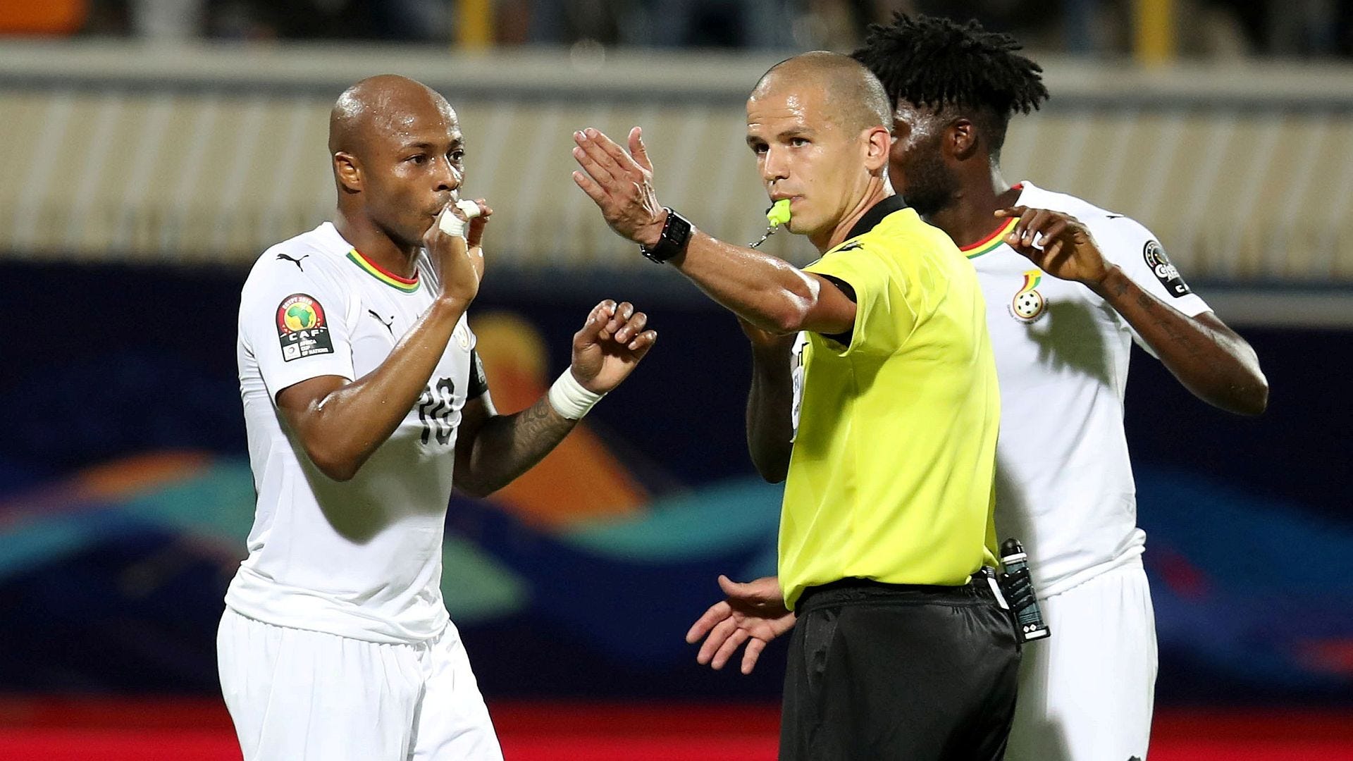 Andre Ayew and Thomas Teye Partey of Ghana, referee Victor Gomes, 2019 Afcon