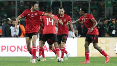 Mohamed Abdelmonem of Al Ahly celebrates goal with teammates.