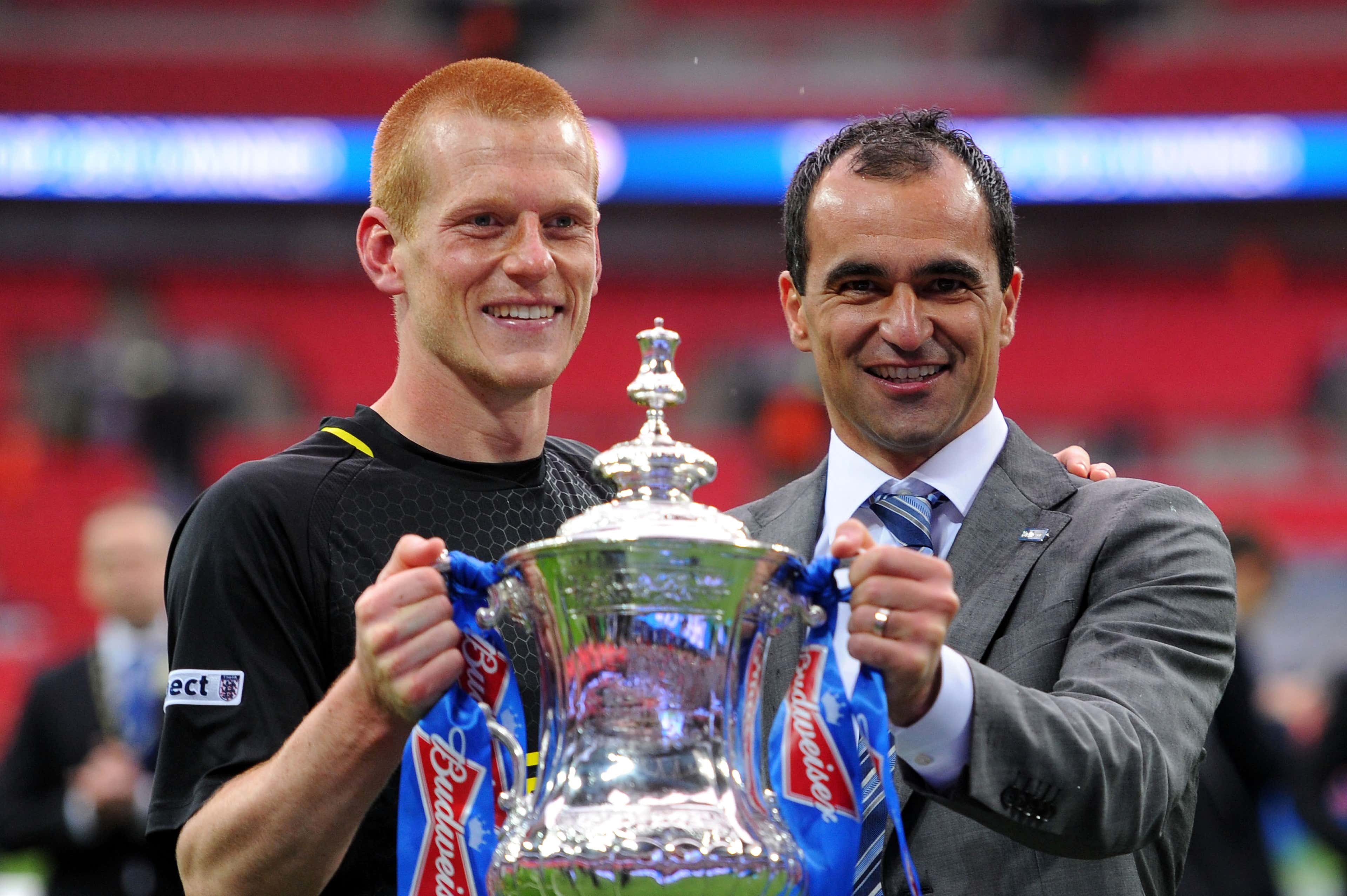 Ben Watson and Roberto Martinez lift the FA Cup