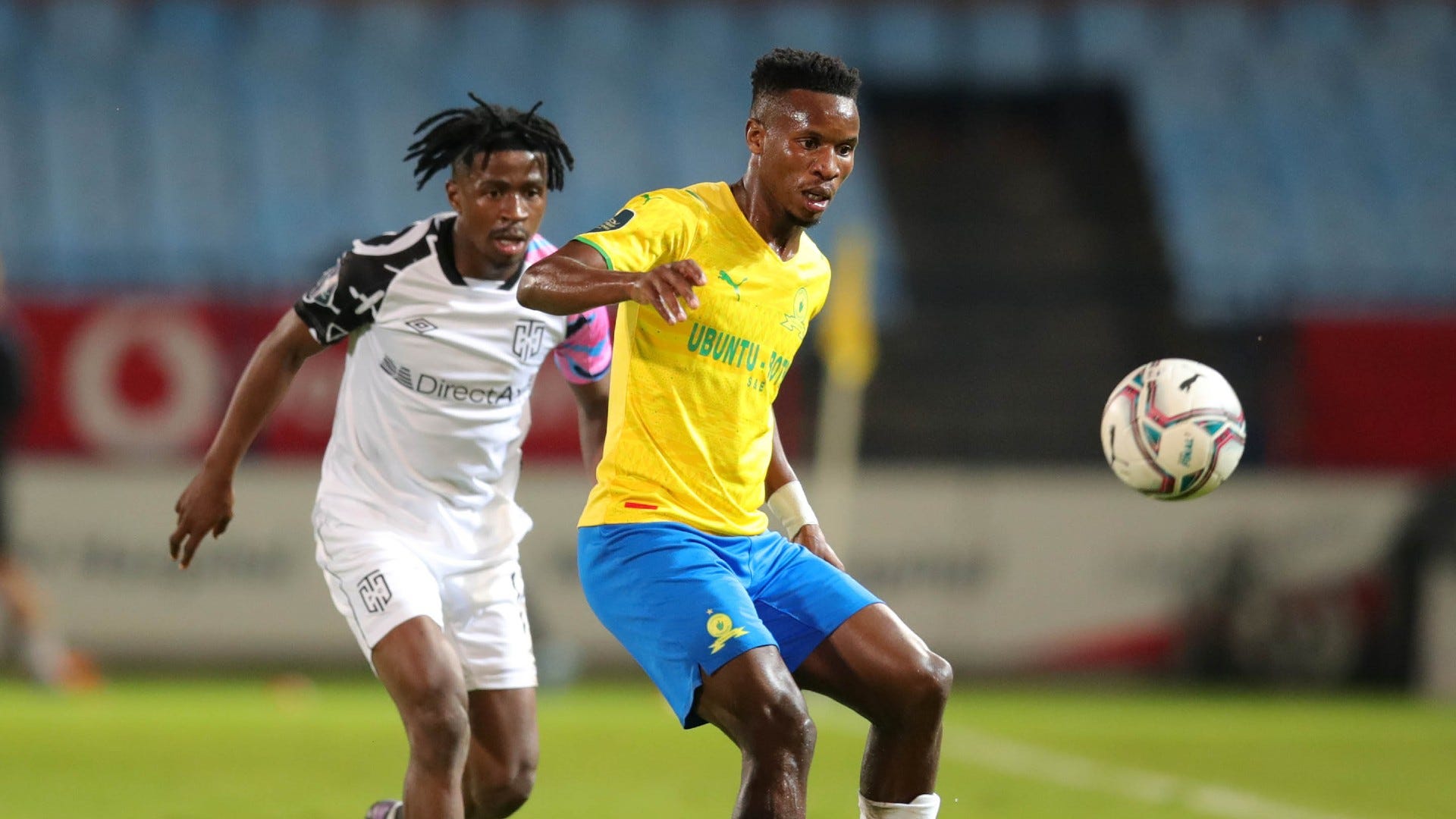 Themba Zwane of Mamelodi Sundowns challenged by Terrence Mashego of Cape Town City, April 2022