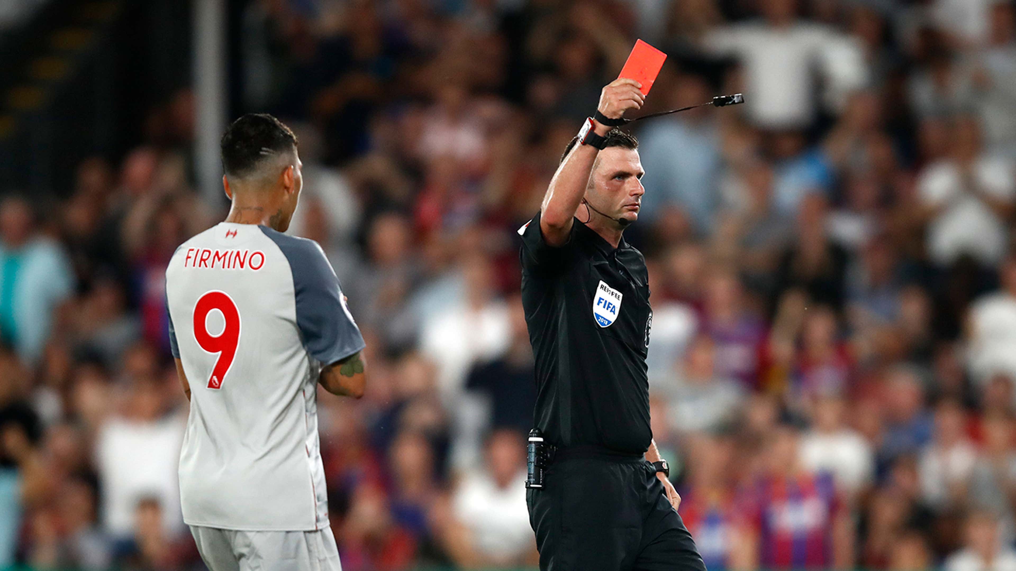 A Referee Holding Up A Red Card High-Res Stock Photo - Getty Images