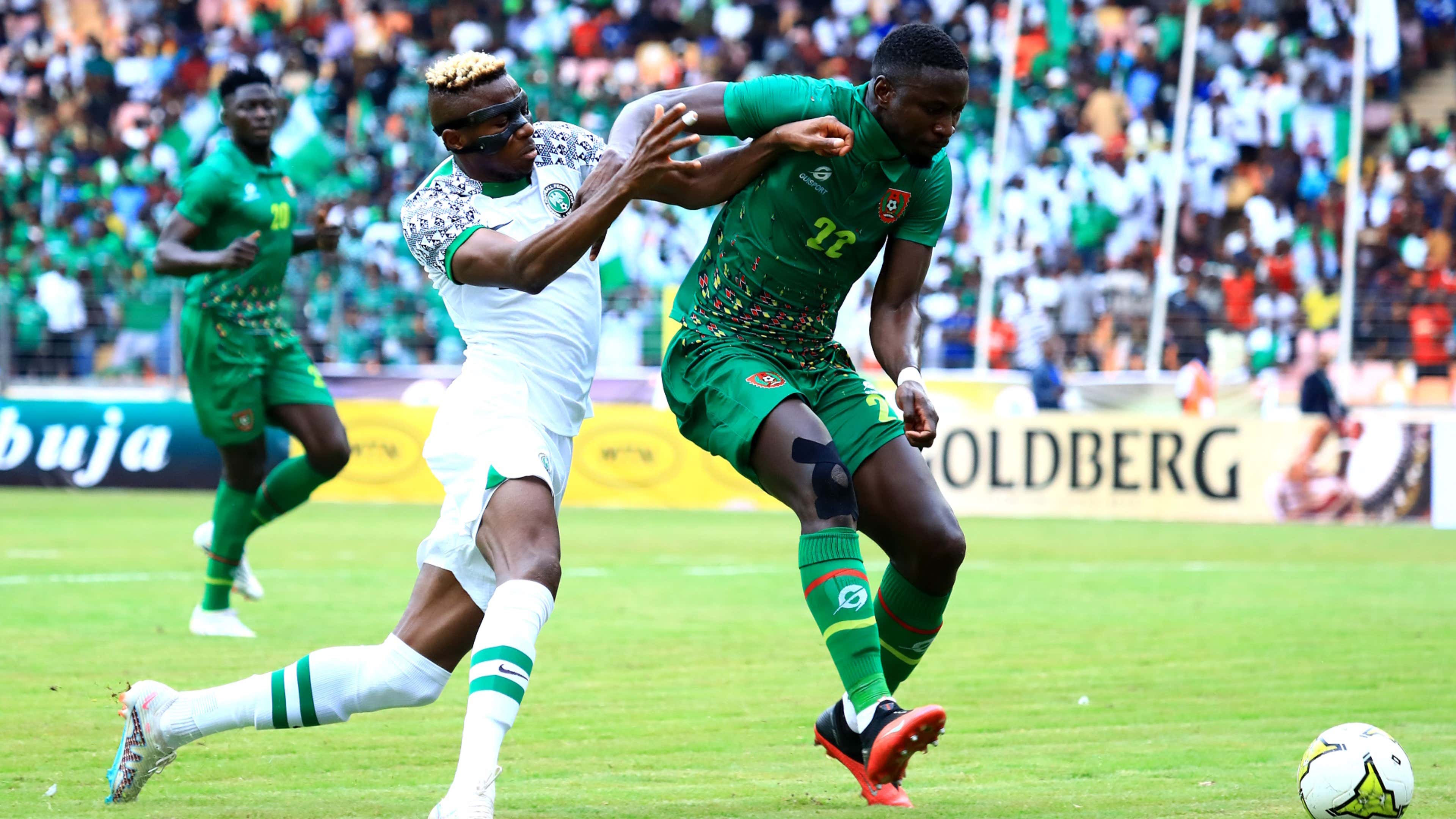 Victor Osimhen of Nigeria challenges Opa Sangante of Guinea-Bissau