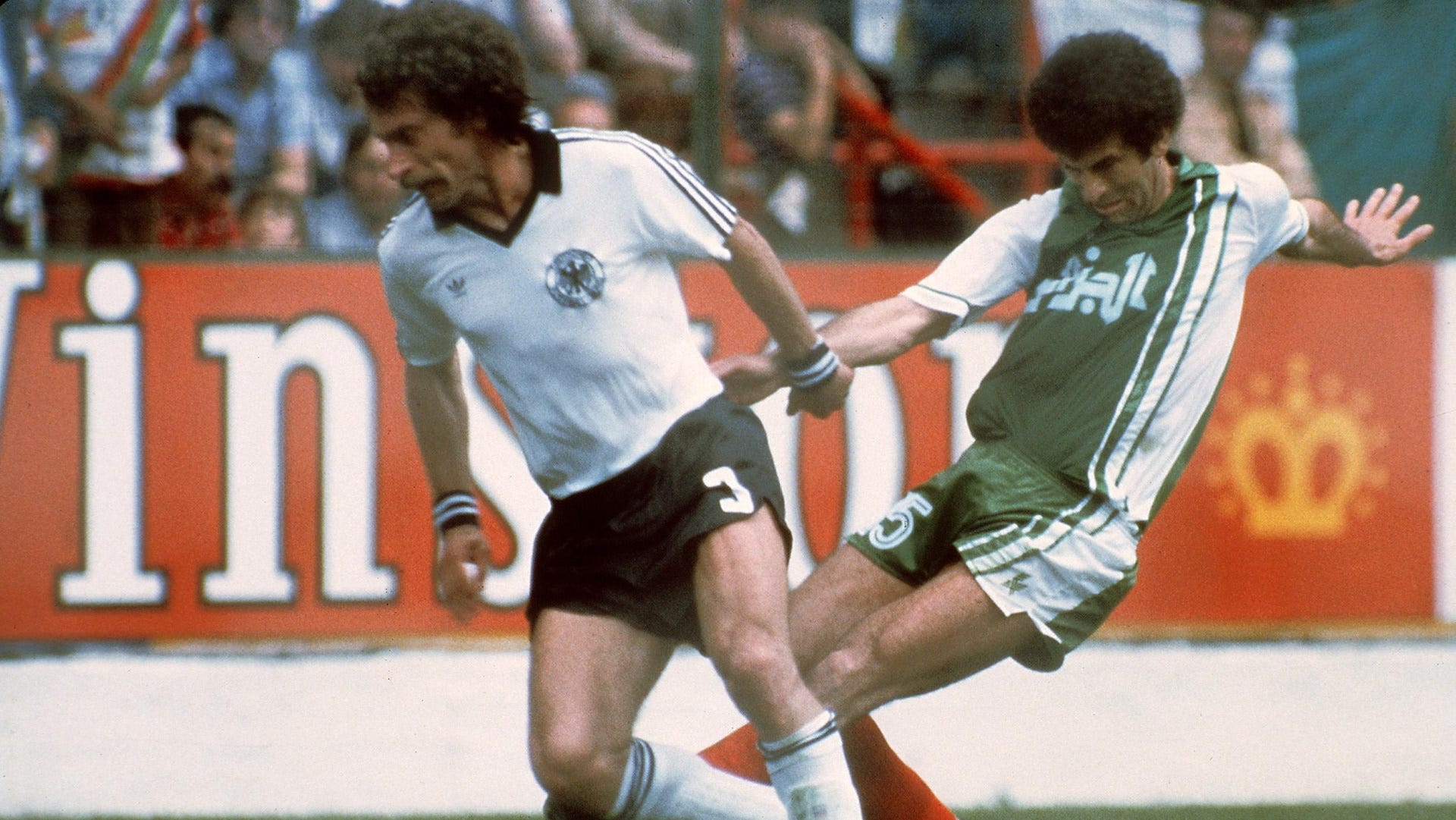Paul Breitner of West Germany, Mustapha Dahleb of Algeria, 1982 World Cup