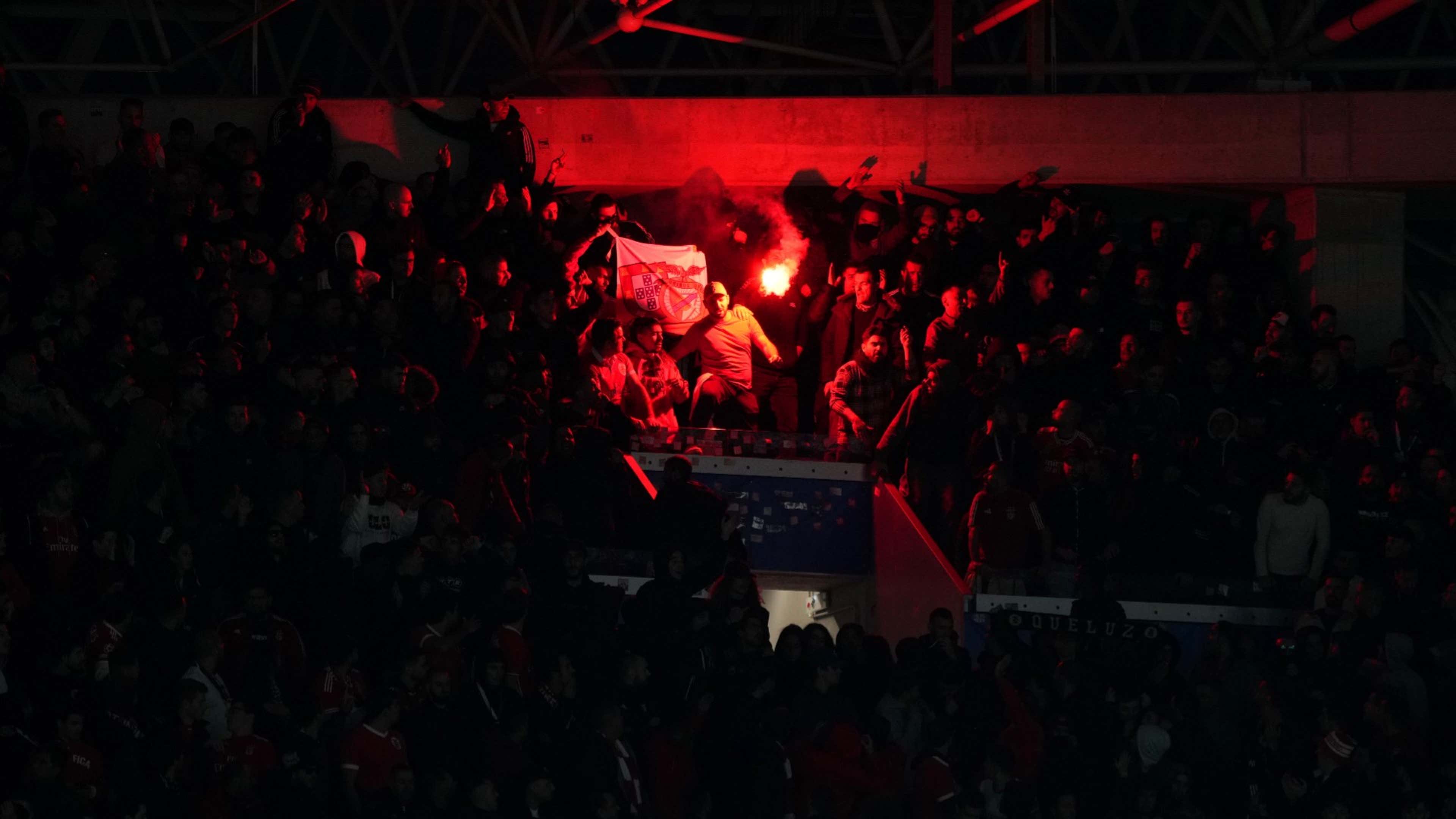 Benfica fans throw flares toward Sociedad supporters at Champions League  match