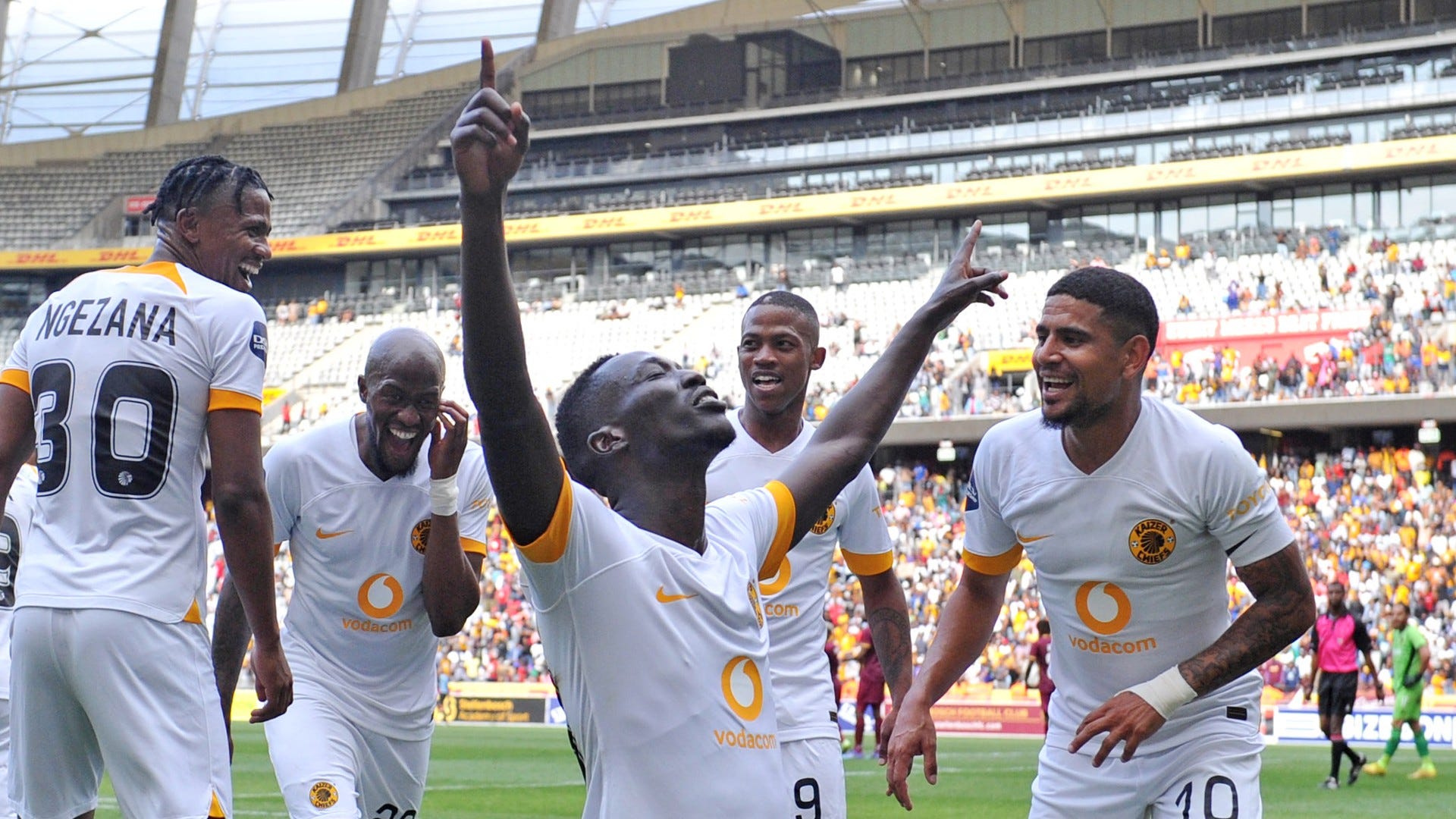 Bonfils-Caleb Bimenyimana and Keagan Dolly celebrate with Kaizer Chiefs teammates, October 2022