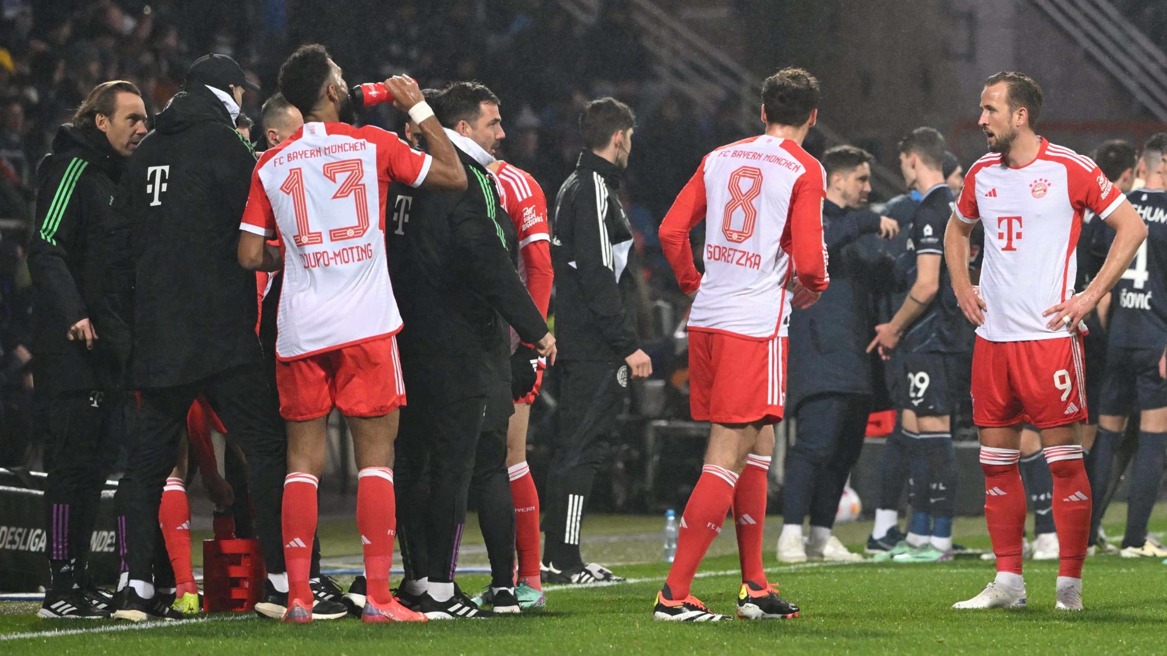 Chaos in the Bundesliga! Bochum vs Bayern Munich stopped twice as fans stage protest by launching tennis balls onto pitch - minutes after Harry Kane produces one of the worst misses of