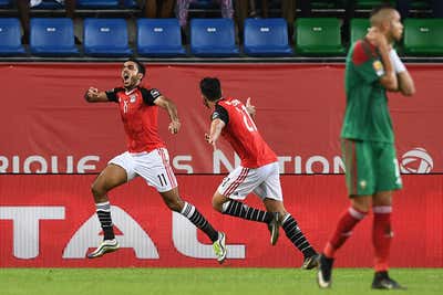Egypt's midfielder Mahmoud Abdel-Moneim (L) Kahraba celebrates with Egypt's midfielder Mahmoud Hassan