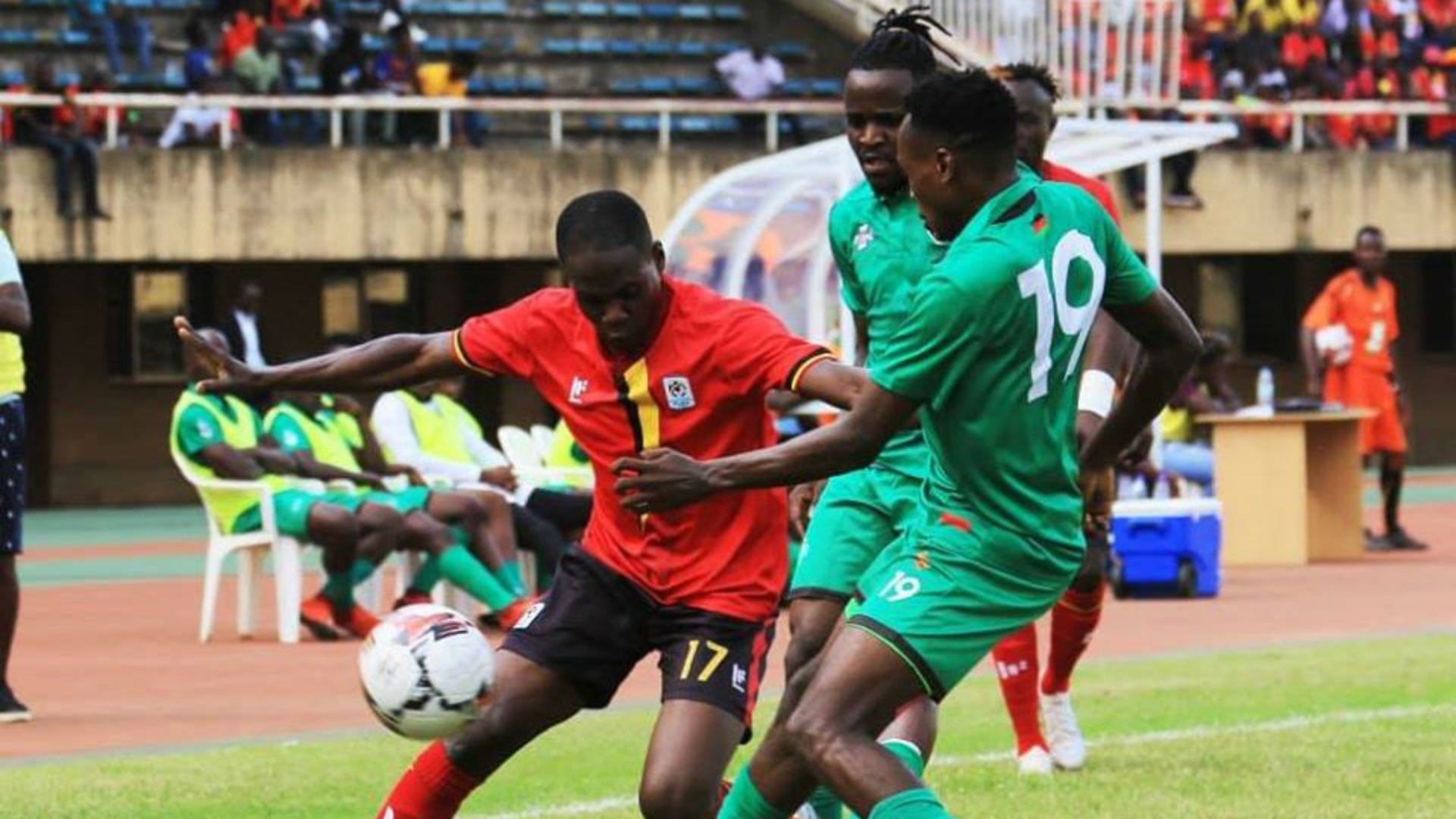 Uganda player vs Malawi.