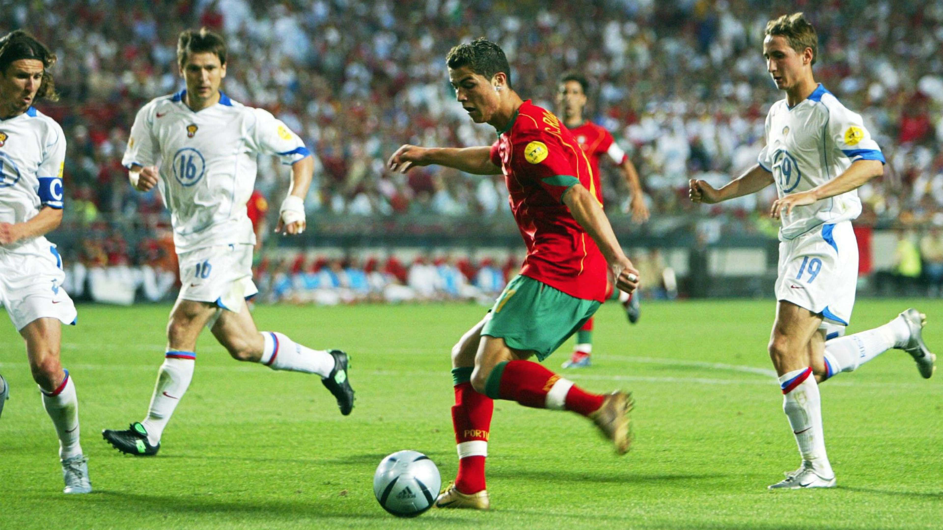 Cristiano Ronaldo taking on Russian defenders in Euro 2004