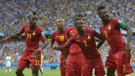 Asamoah Gyan celebrates with teammates.