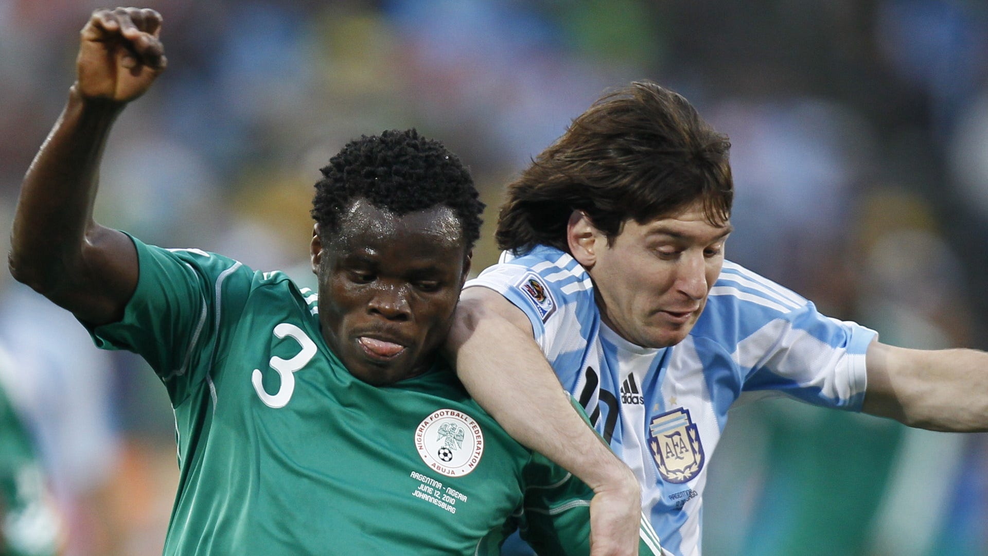 Taye Taiwo of Nigeria & Argentina's Lionel Messi